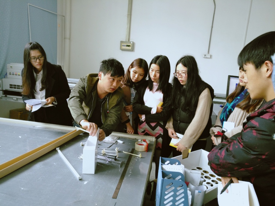 Holidaypac team reviewing physical packaging samples during training