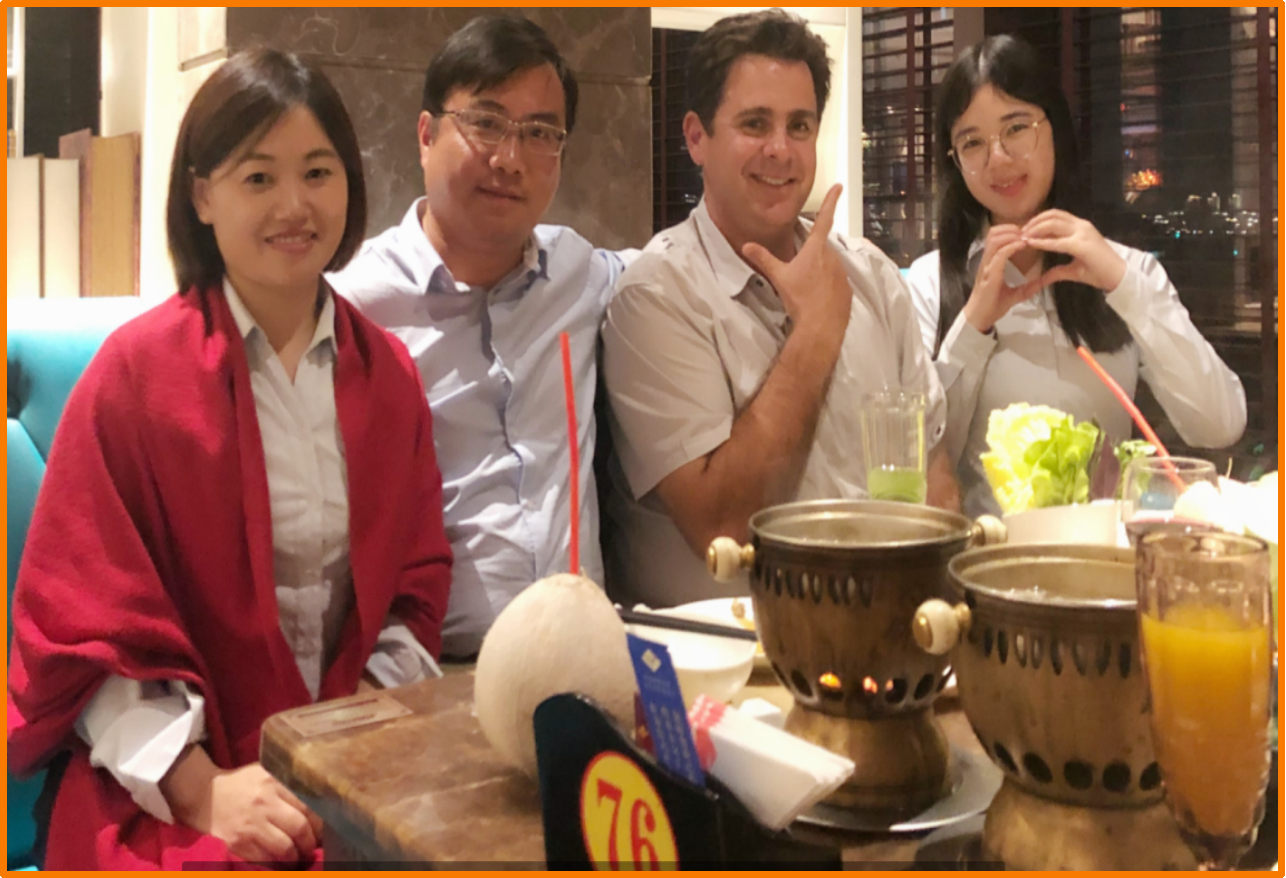 Holidaypac Cassie Lan with international food brand client reviewing custom Japanese-market packaging specs