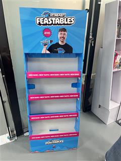 Front view of a four-shelf Feastables chocolate cardboard floor display